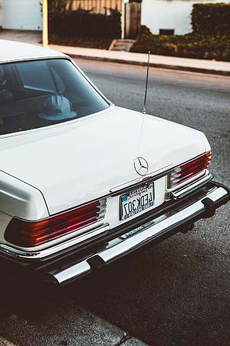 windshield white Mercedes-Benz car parked on road west hollywood
